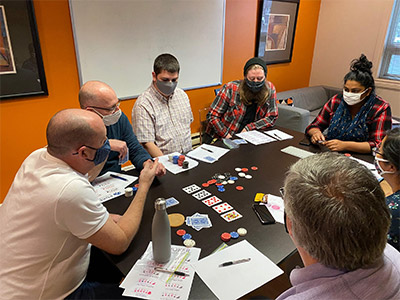 Cards and chips on REM's boardroom table